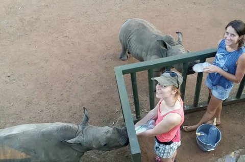 Karina and Jamie feeding rhino orphans Kabelo and Kabira - photos courtesy the rhino orphanage